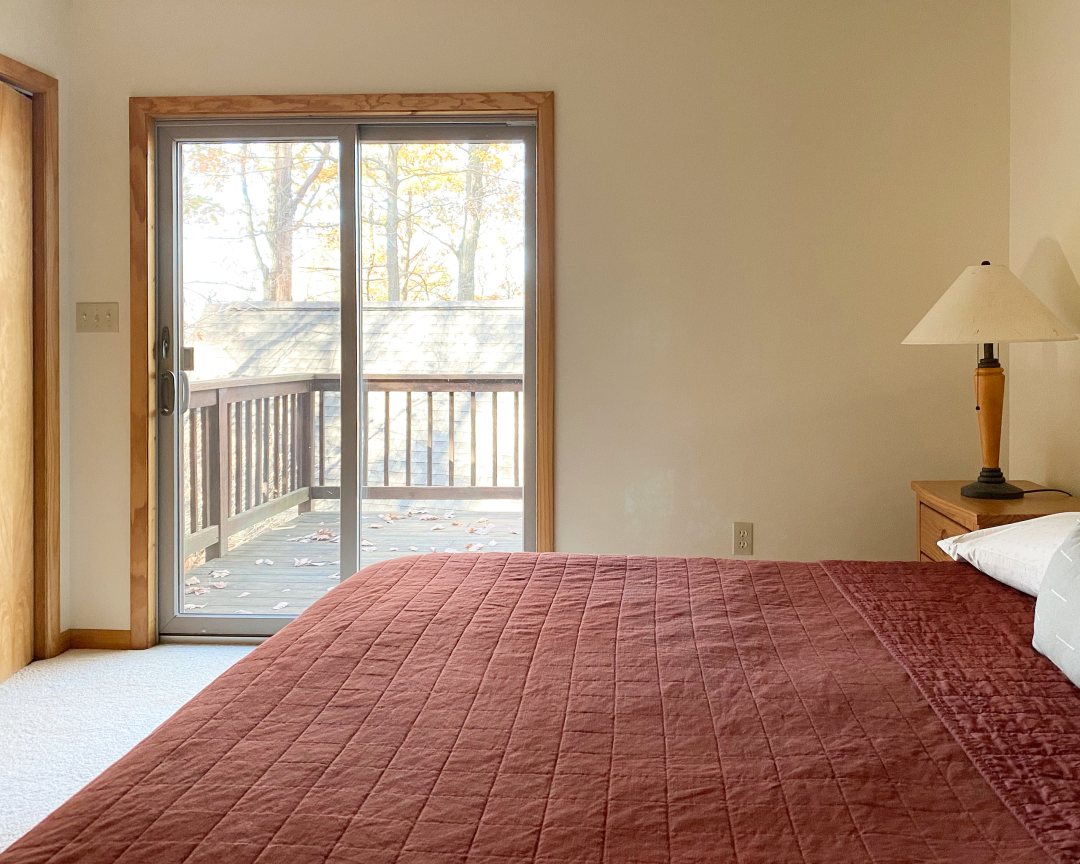 Cabin bedroom with patio door