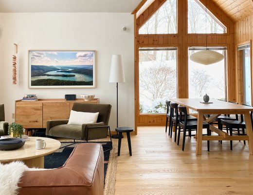 Cabin Interior with wood floors and a view of the snow