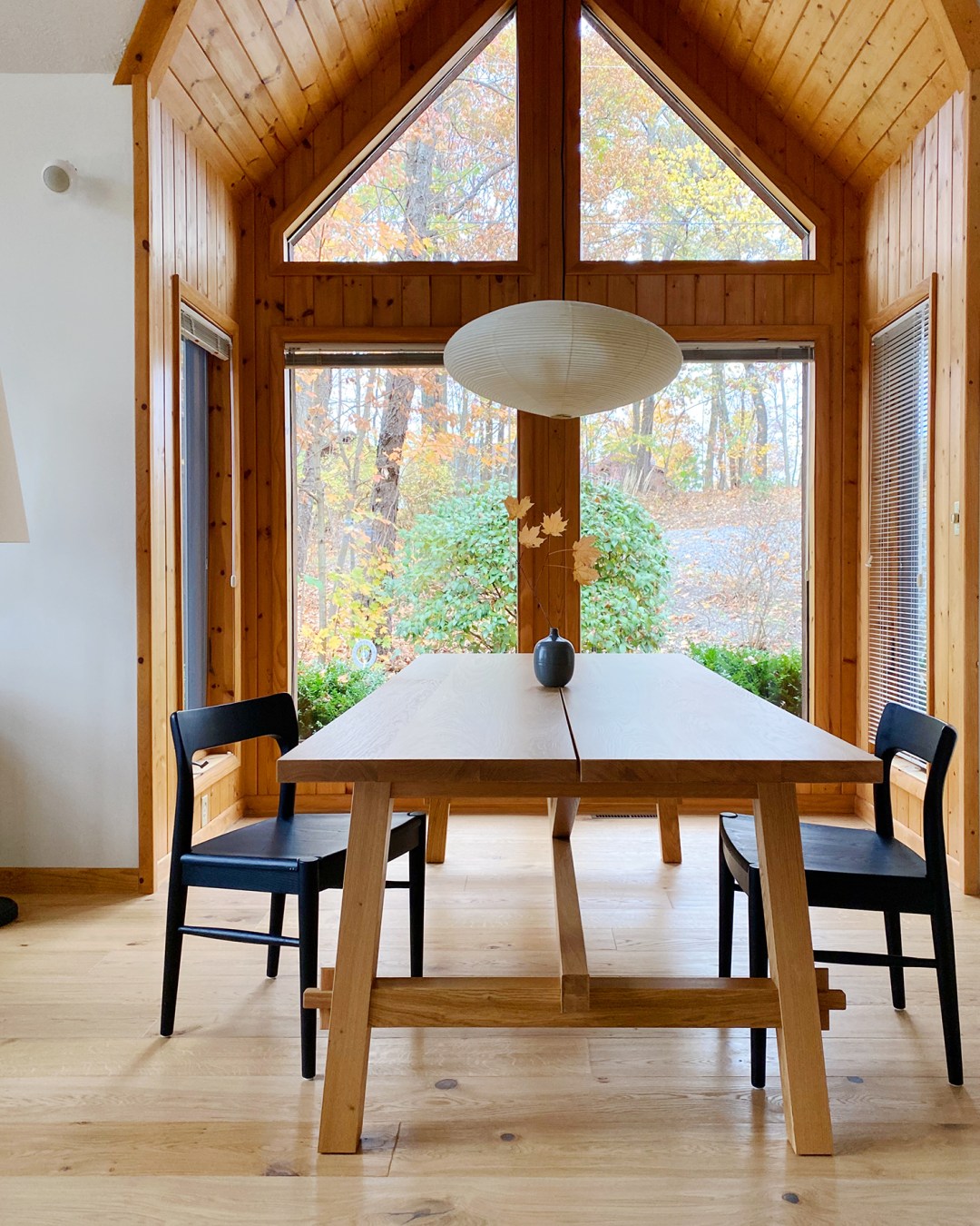 IKEA MOCKELBY Dining Table with black wooden chairs